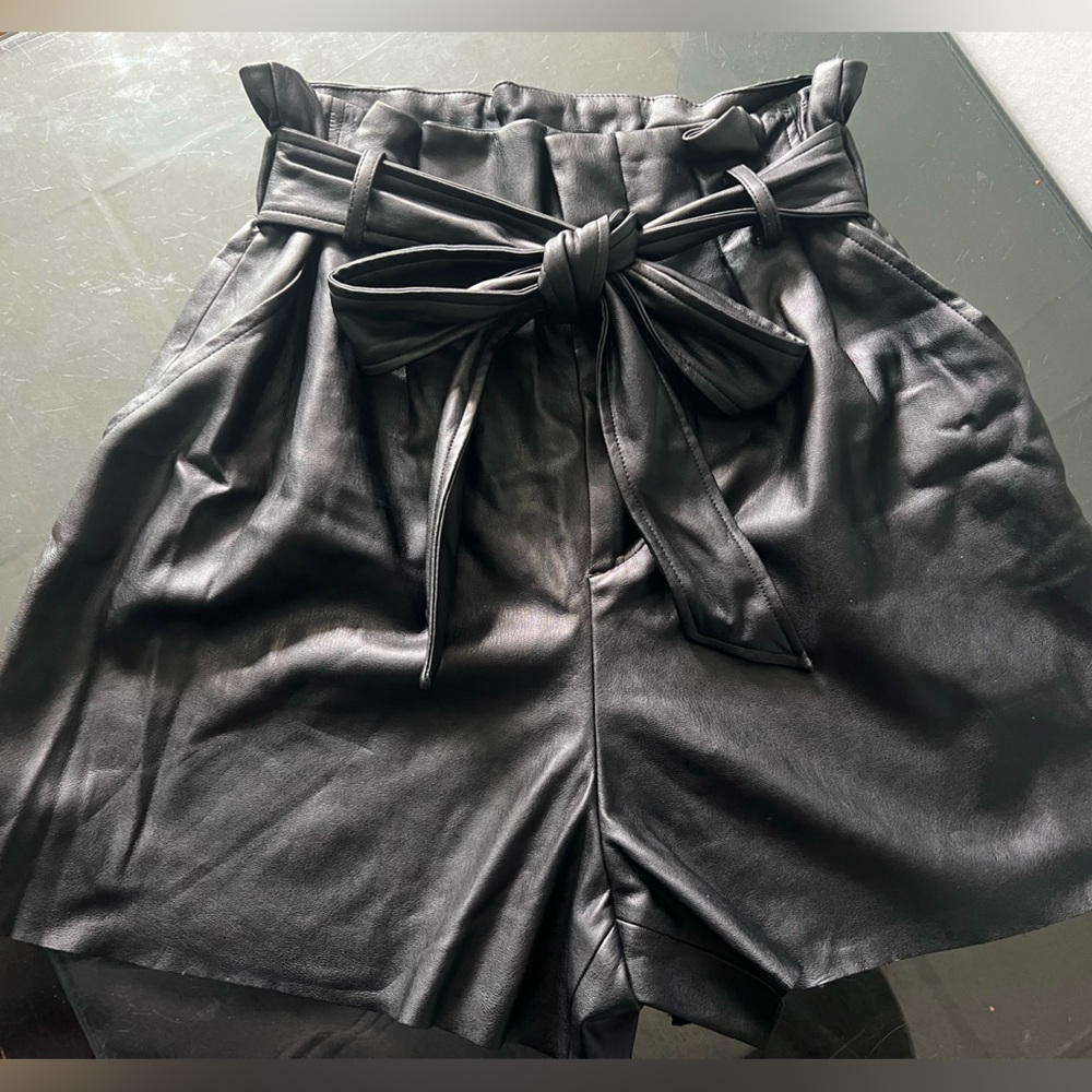 Zara high-waisted faux leather paperbag shorts in black.